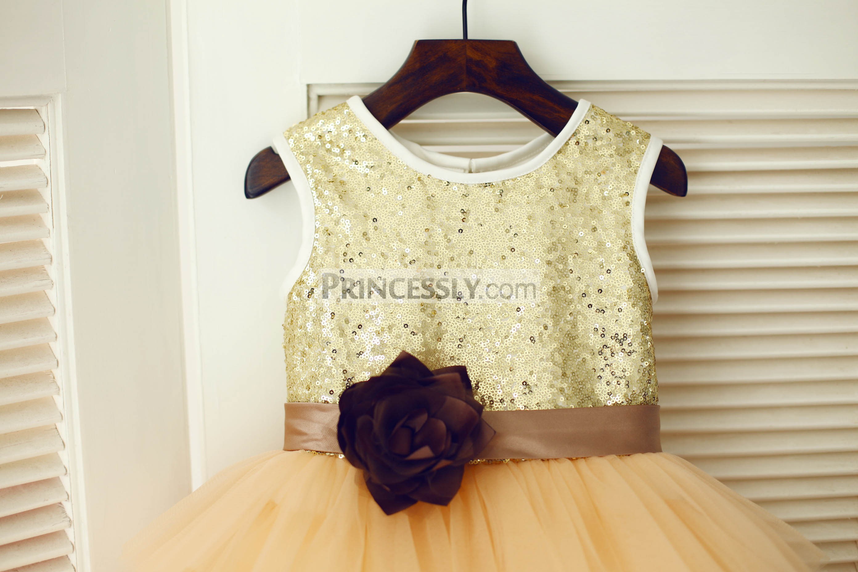 Blooming flower sash of gold sequin bodice