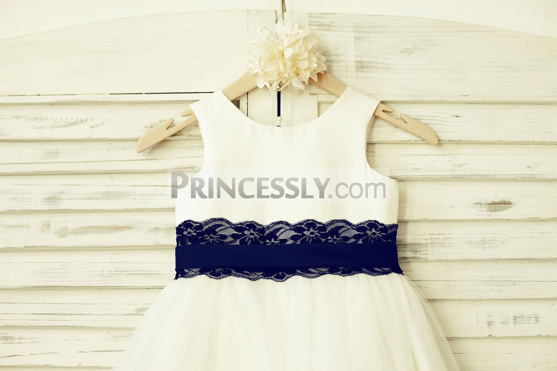 Panel bodice in scoop neckline & sleeveless with navy blue lace belt