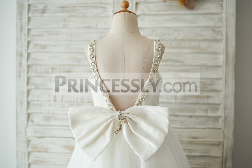 Deep V open back with a big pre-made satin bow