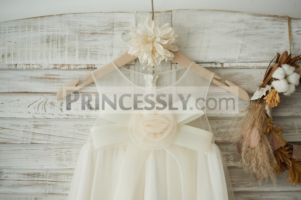 Scoop neckline sleeveless sheer tulle bodice with a bow