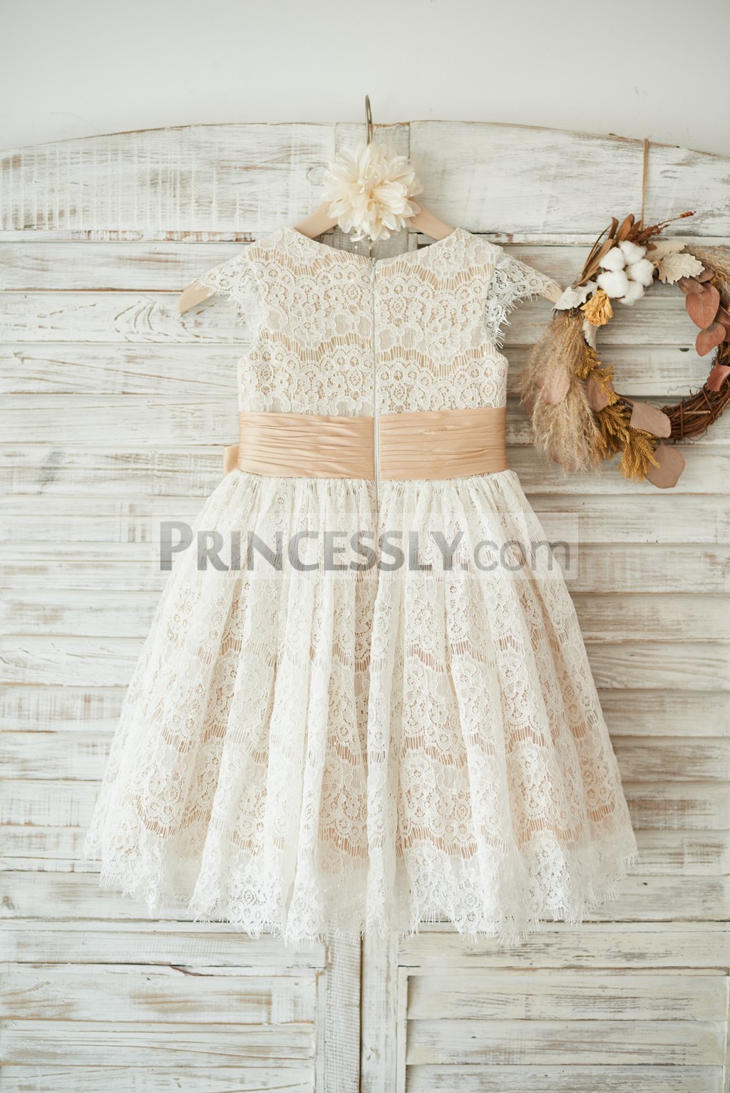 Ivory lace sticks out of skirt w/ fixed champagne satin belt