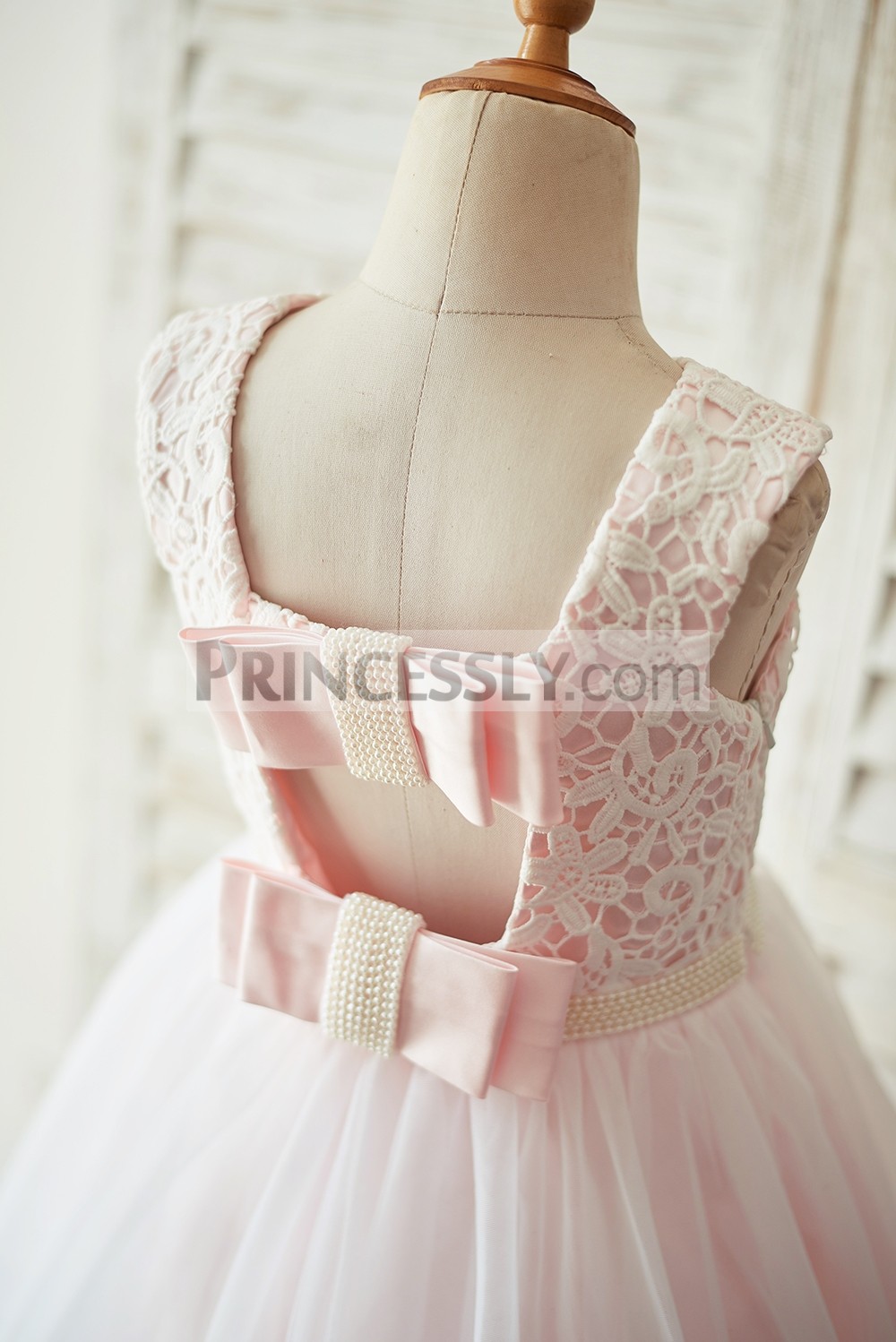 Open back with two pink bows